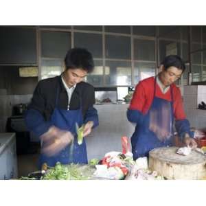  Restaurant Cooks Chop Food as They Prepare Meals, Qinghai 