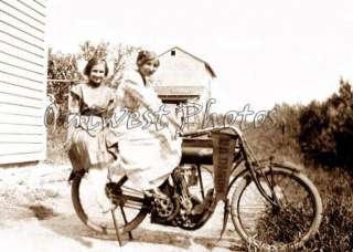 Photo of 2 Girls on a Early Vintage Indian Motorcycle  