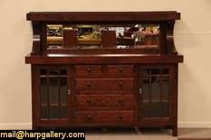 This sideboard shows authentic Arts and Crafts period design from the 