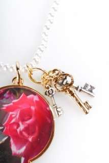necklace with gold plated key hole featuring the talking flowers new 