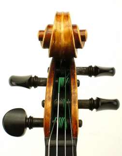   full sized violin. The back measures 13 7/8 inches or 354 mm