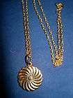 Clockwise Rotating Sun Impression Charm with Gold Chain