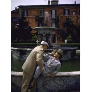 Sophia Loren and Carlo Ponti Posing in Front of a Large Fountain at 