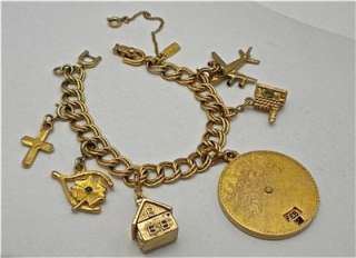 Vintage MONET Gold Tone Charm Bracelet   7 Charms, 2 Mechanical   7 